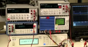 Engineer testing power adapter efficiency at XJK Power laboratory for DOE Level VI and EU CoC Tier 2 compliance